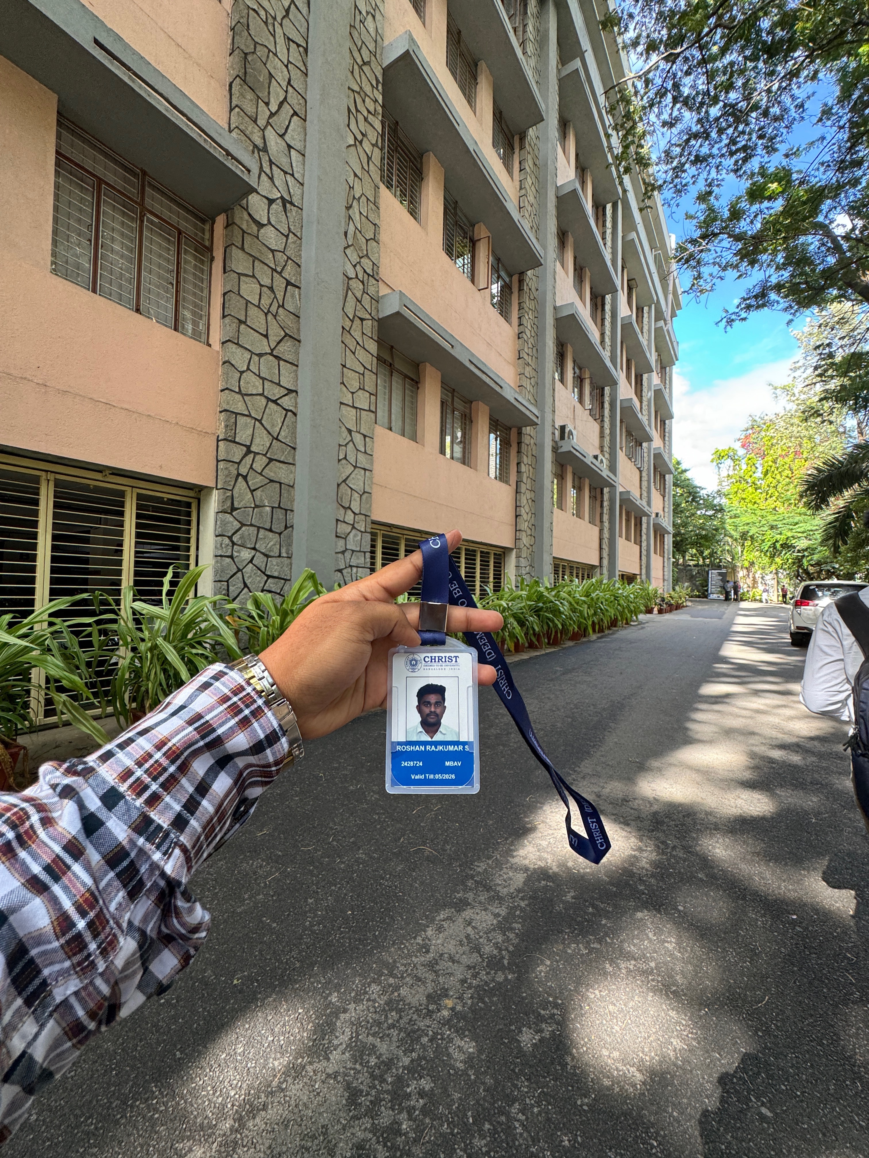 Roshan Rajkumar Sivakumar holding Christ University MBA student ID card at Christ University Bengaluru campus — first days as MBA student 2024