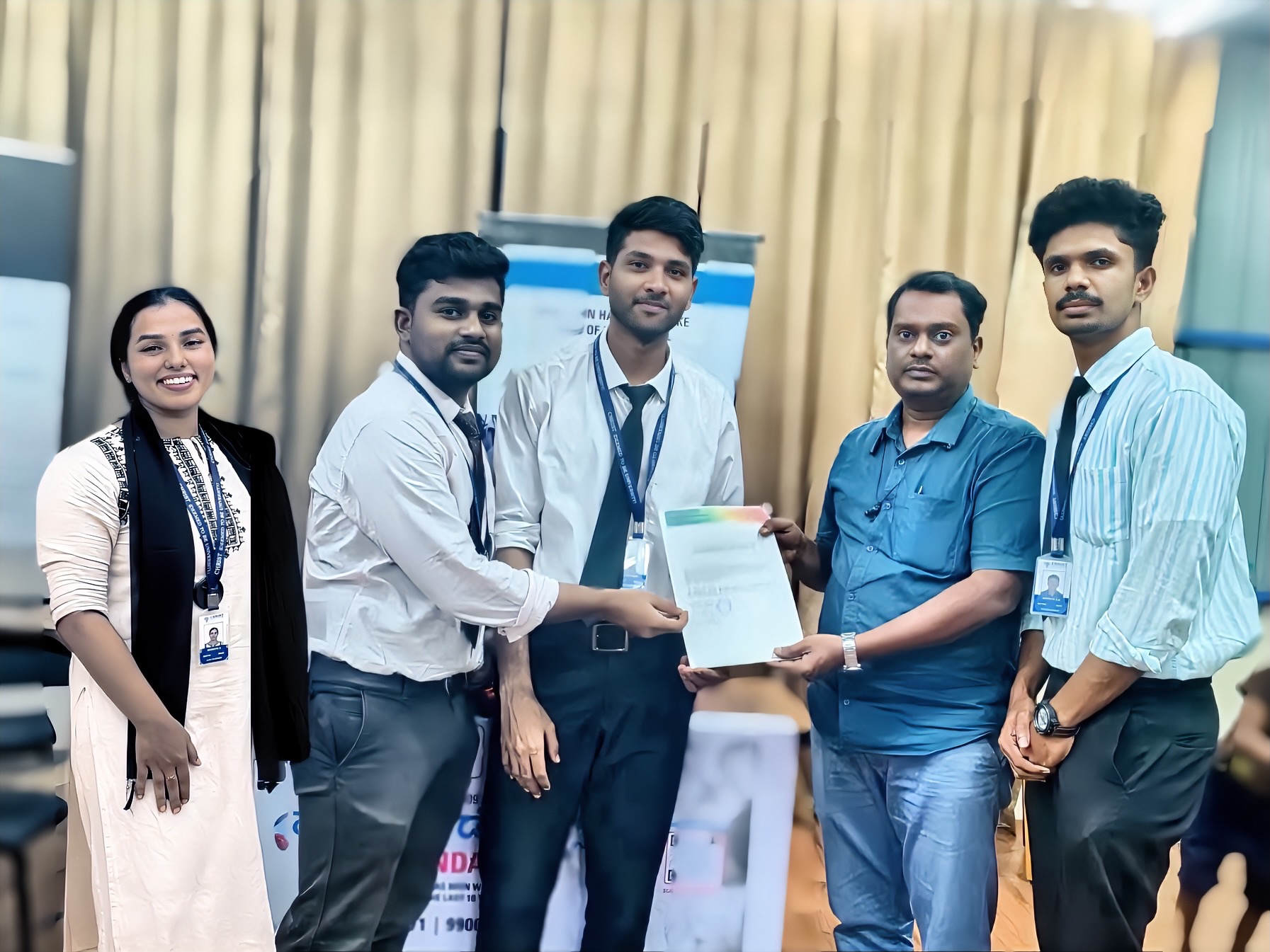 Roshan Rajkumar Sivakumar and team receiving 30-hour volunteering completion certificate from VARA Foundation representative at Christ University Bengaluru community service programme