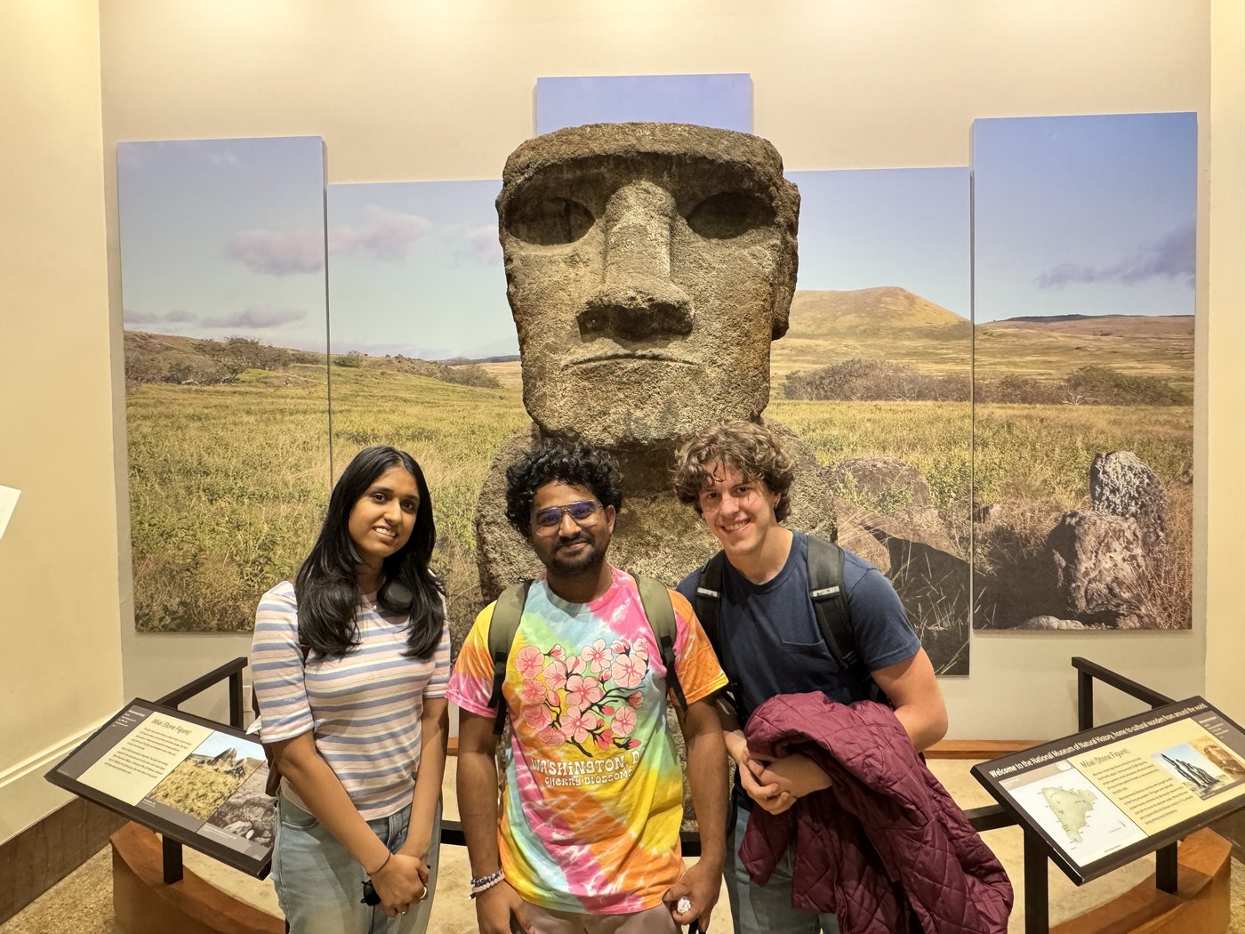 Roshan R Sivakumar with Amala and Rilee at the Natural History Museum Washington DC, April 5 2026, standing in front of Moai Easter Island statue