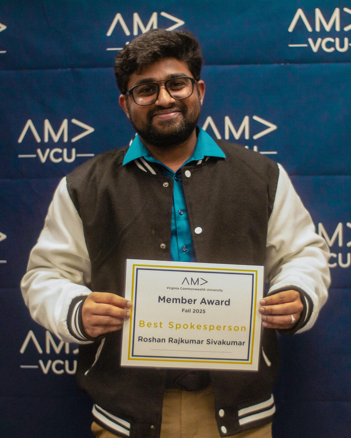 Roshan R Sivakumar receiving the AMA Best Spokesperson Award at VCU