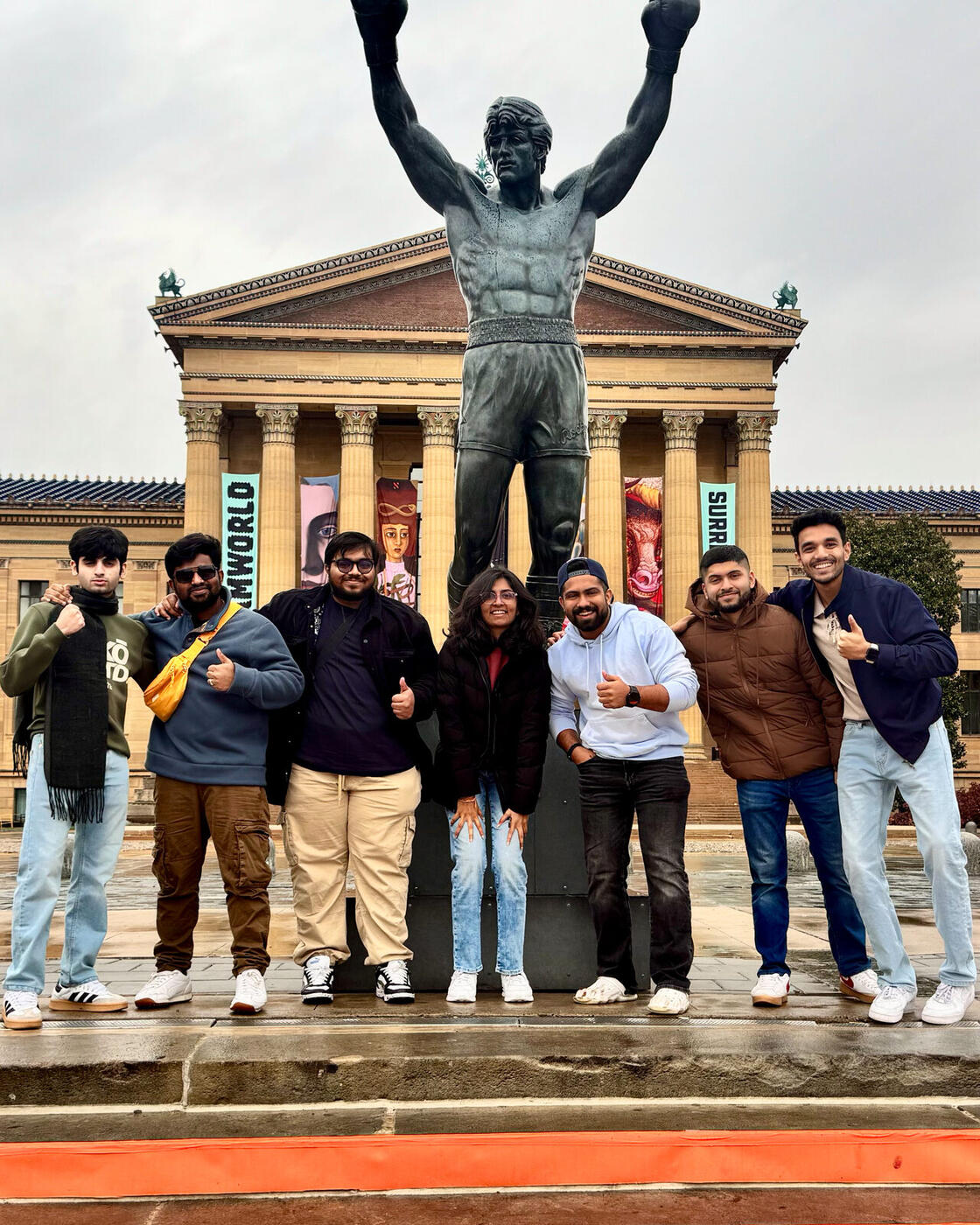 Roshan R Sivakumar with a friend at the Rocky statue in Philadelphia